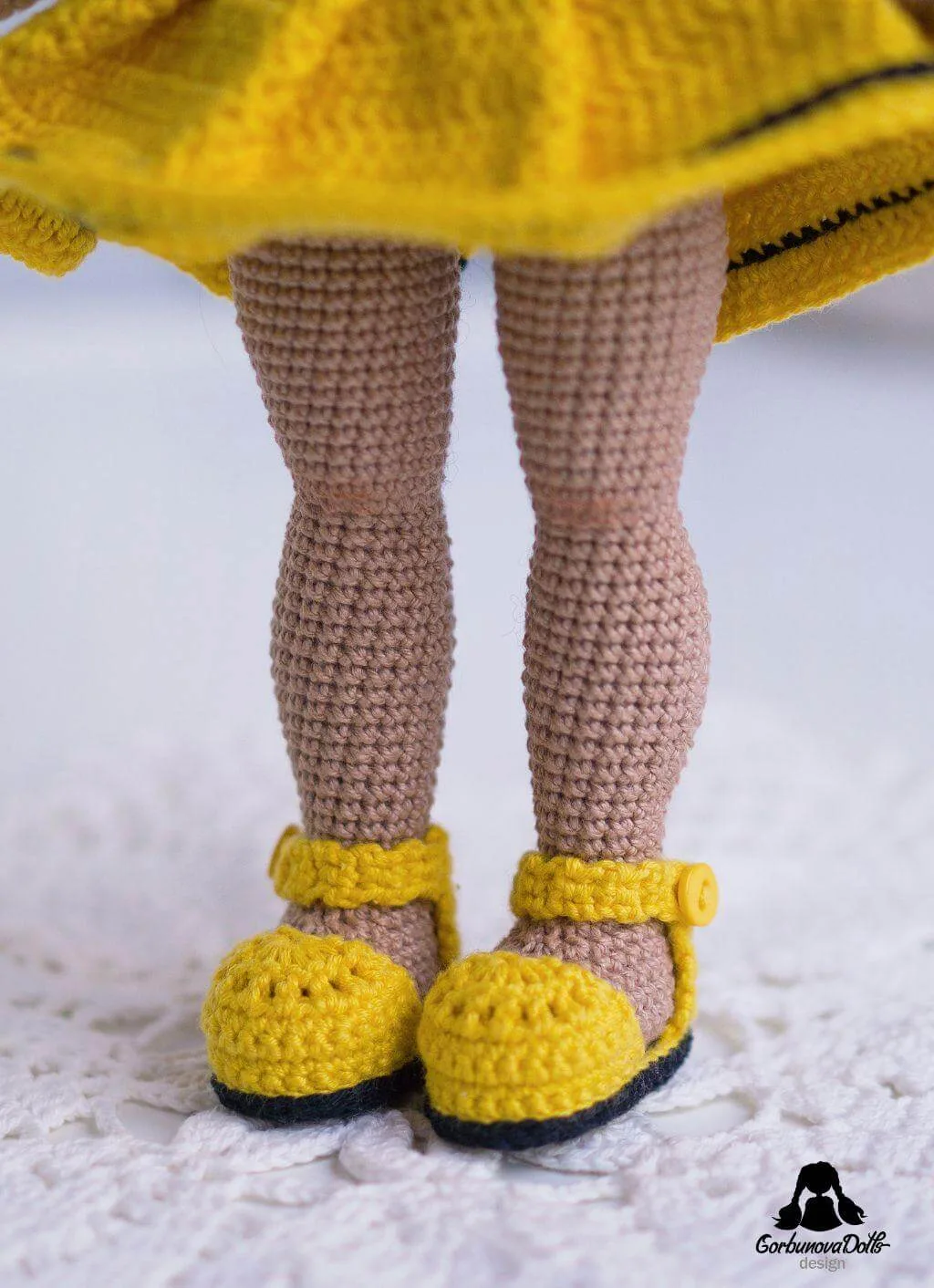 Close-up of Michelle crochet doll’s legs wearing shoes from crochet doll pattern