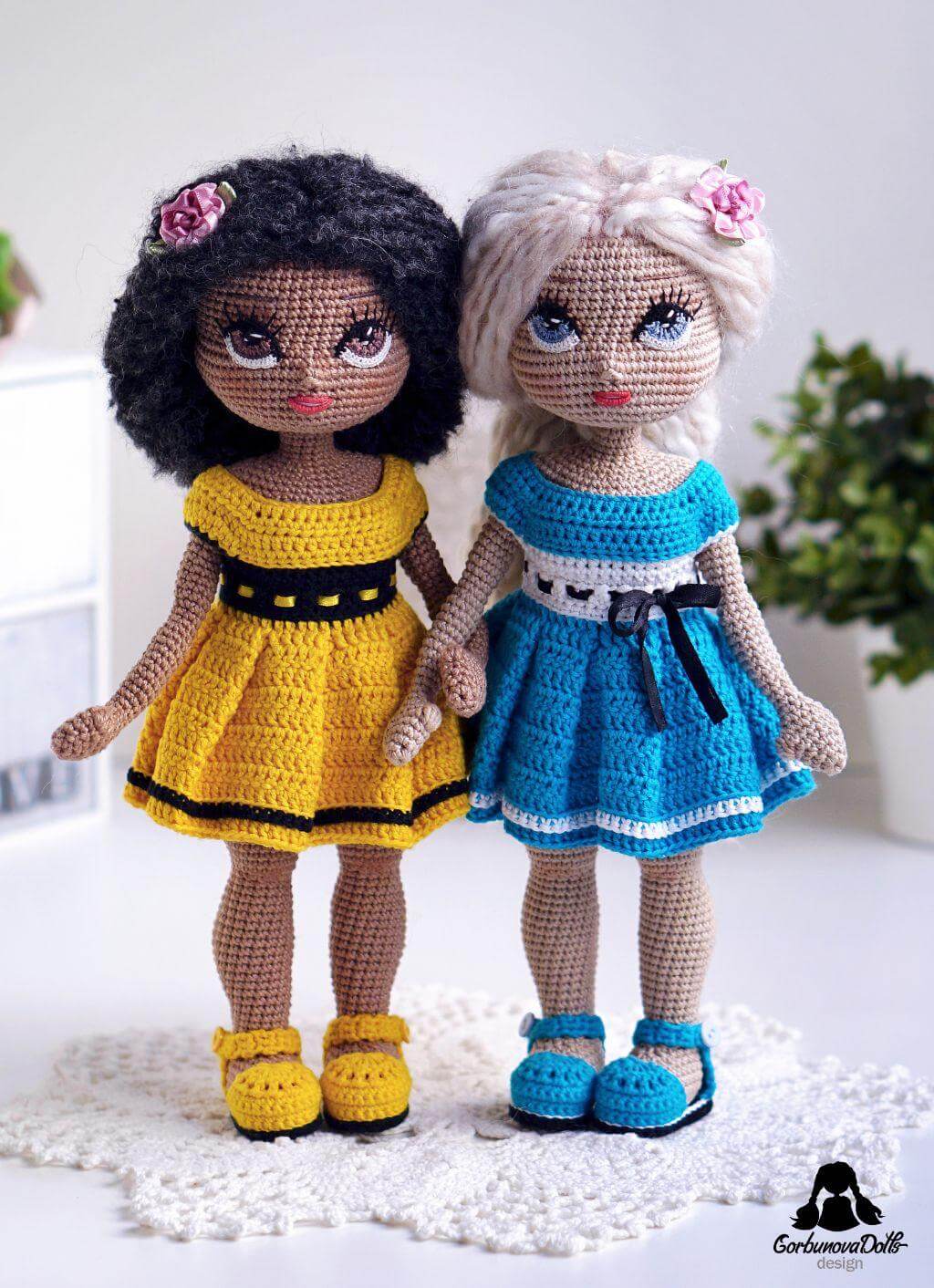 Two Michelle crochet dolls in dresses — one dark-skinned, one light-skinned, crochet doll pattern