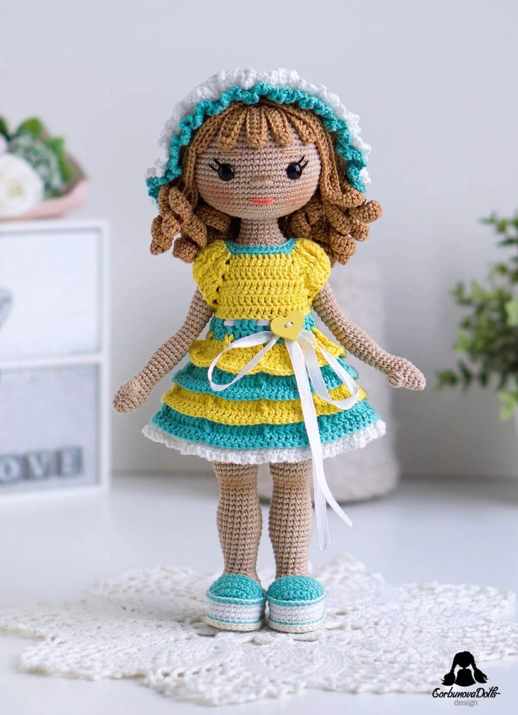 Crochet doll pattern with clothes - finished amigurumi doll with seamless no-sew body, removable outfit, safety eyes, and detailed curly crocheted wig hairstyle