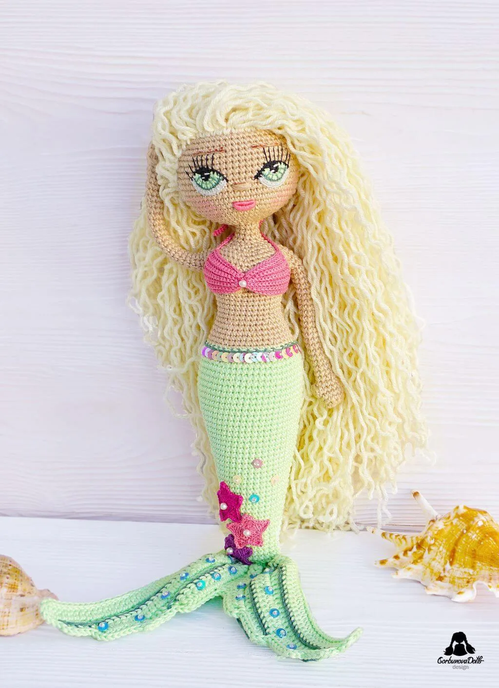 Mermaid crochet pattern - beautifully crafted seamless amigurumi mermaid doll in bikini top with detailed star decorations on her tail