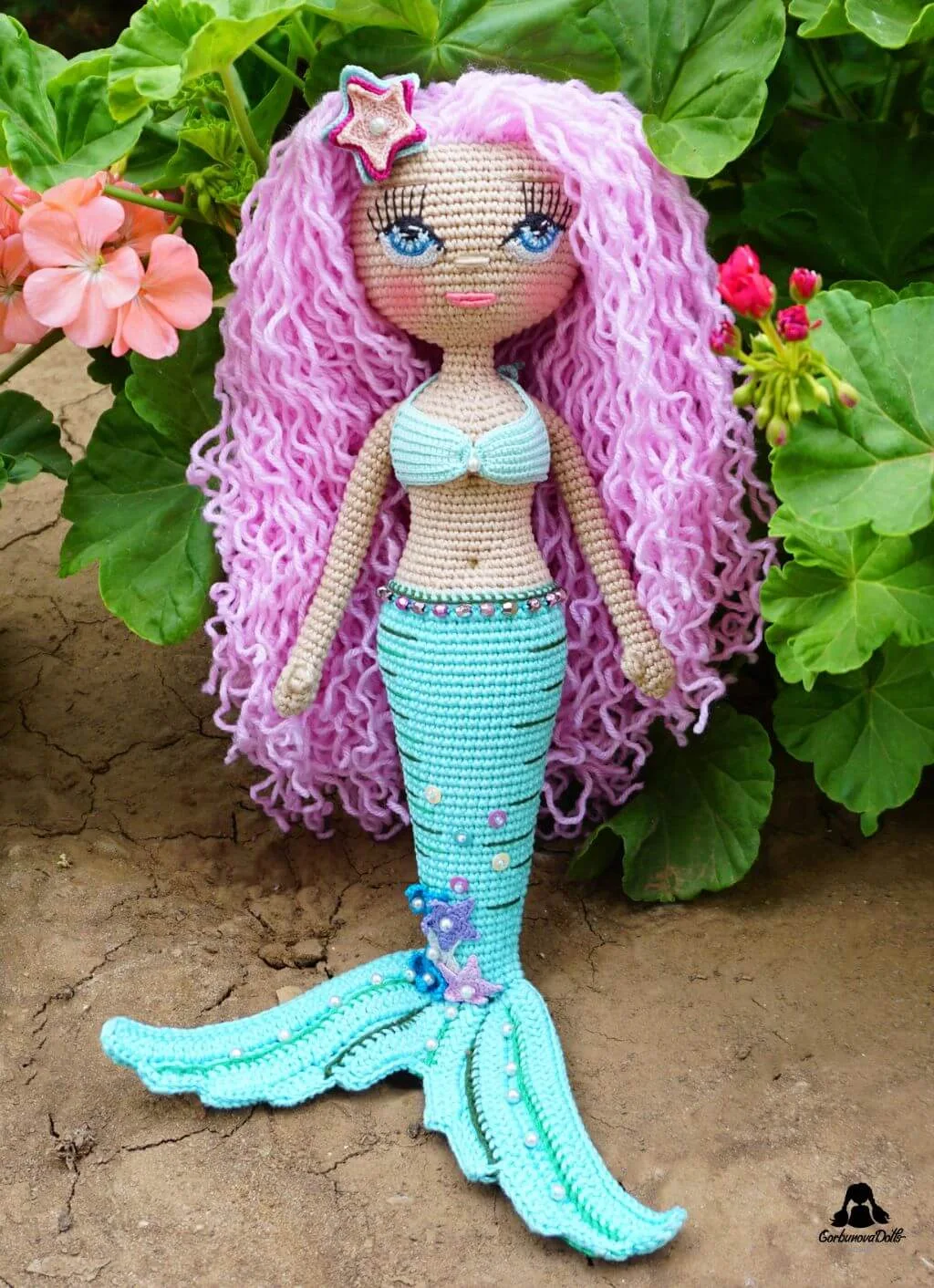 Mermaid crochet pattern - beautifully crafted seamless amigurumi mermaid doll in bikini top with detailed star decorations on her tail