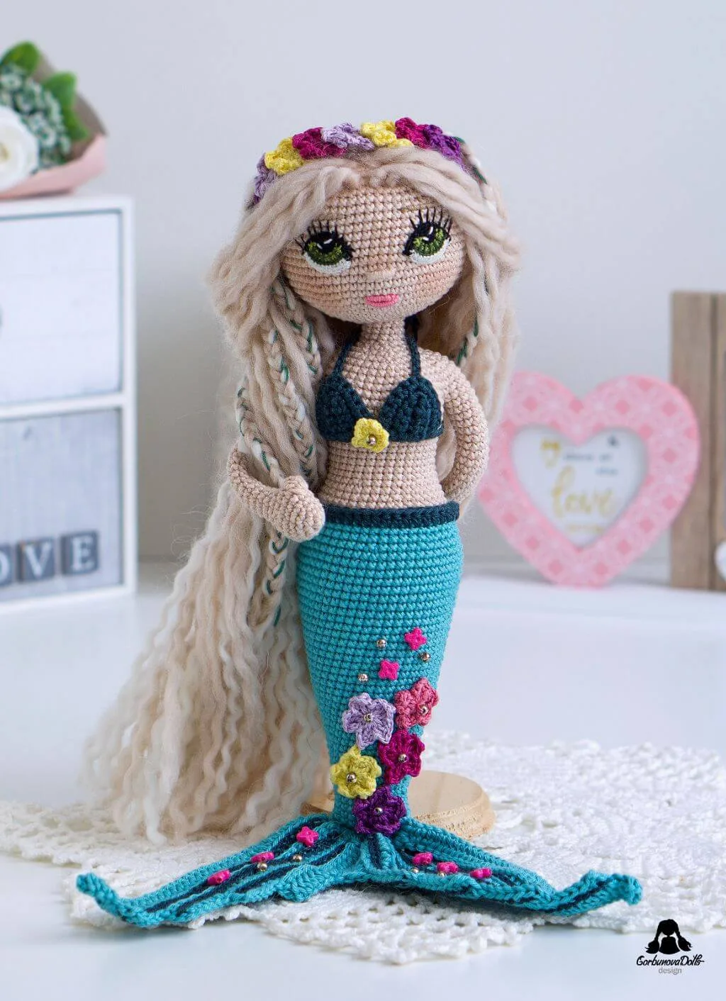 Mermaid crochet pattern - beautifully crafted seamless amigurumi mermaid doll in bikini top with detailed star decorations on her tail