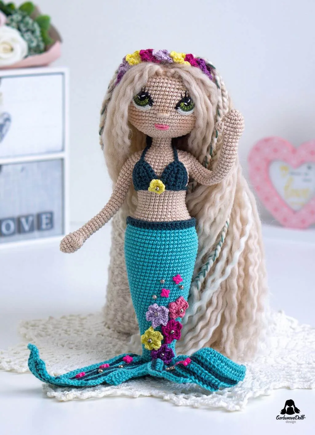 Mermaid crochet pattern - beautifully crafted seamless amigurumi mermaid doll in bikini top with detailed star decorations on her tail