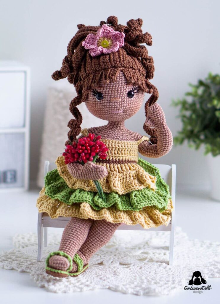 Emily crochet doll pattern with removable dress flip-flops and floral accessories