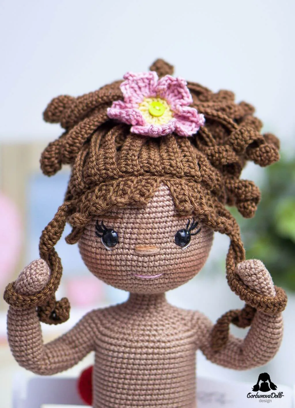 Close-up of Emily's sweet face and upper body, lovingly made from the amigurumi doll pattern