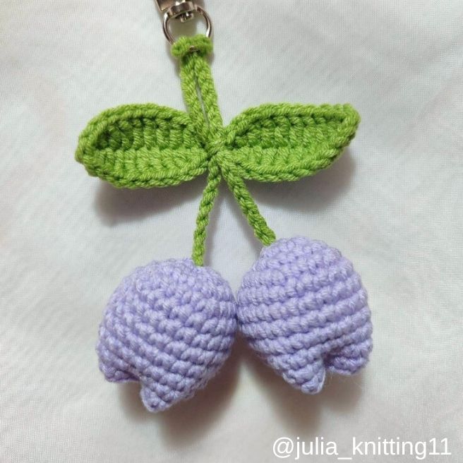 crochet keychain pattern free - finished keychain with two crocheted tulips hanging on clasp