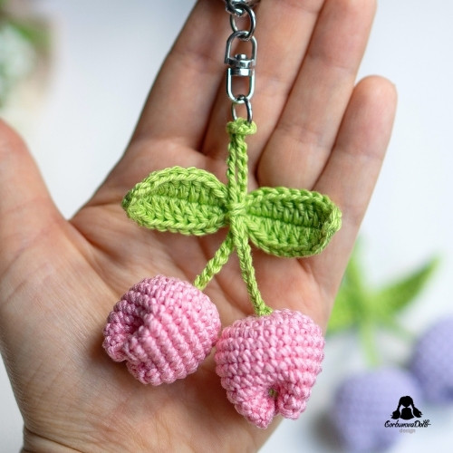 crochet keychain pattern free - finished keychain with two crocheted tulips hanging on clasp