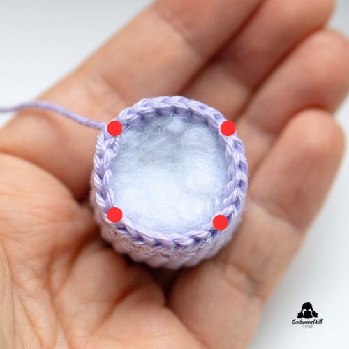 crochet tulip keychain tutorial – red marks showing where to sew the stuffed tulip closed