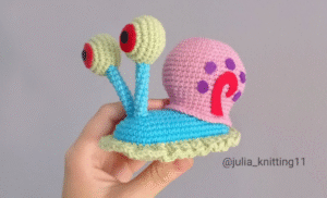 Finished crochet Gary the Snail held in hand