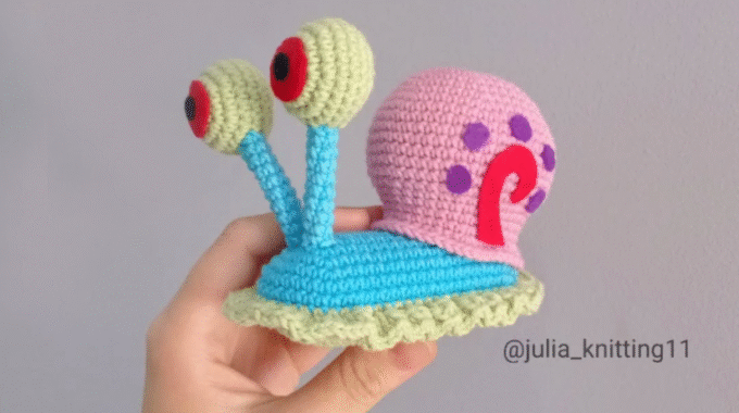 Finished crochet Gary the Snail held in hand