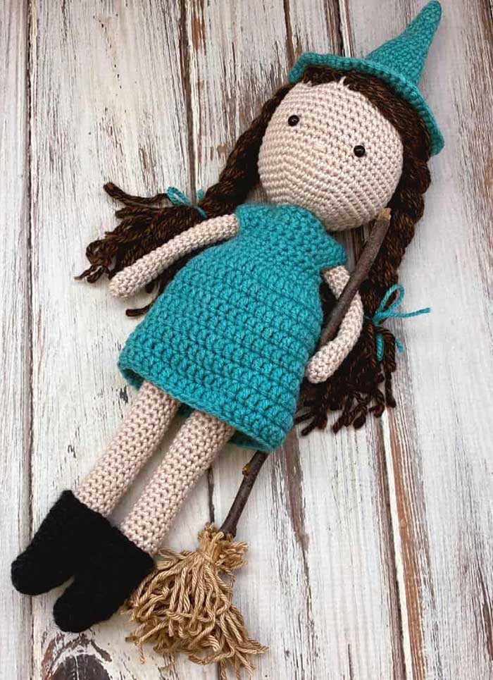 Maddie crochet doll pattern with teal dress witch hat boots and broom