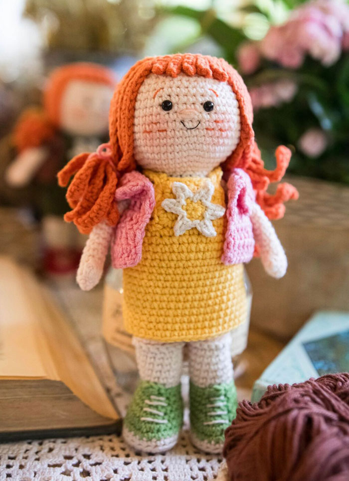 Sally Humphrey crochet doll pattern with overall dress vest sneakers and daisy applique