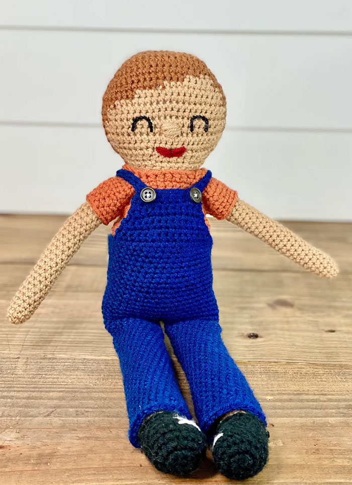Grayson crochet boy doll pattern with blue overalls shirt and shoes
