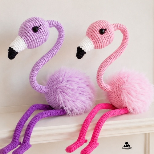 two finished crochet flamingos free amigurumi pattern – handmade pink and purple flamingo toys